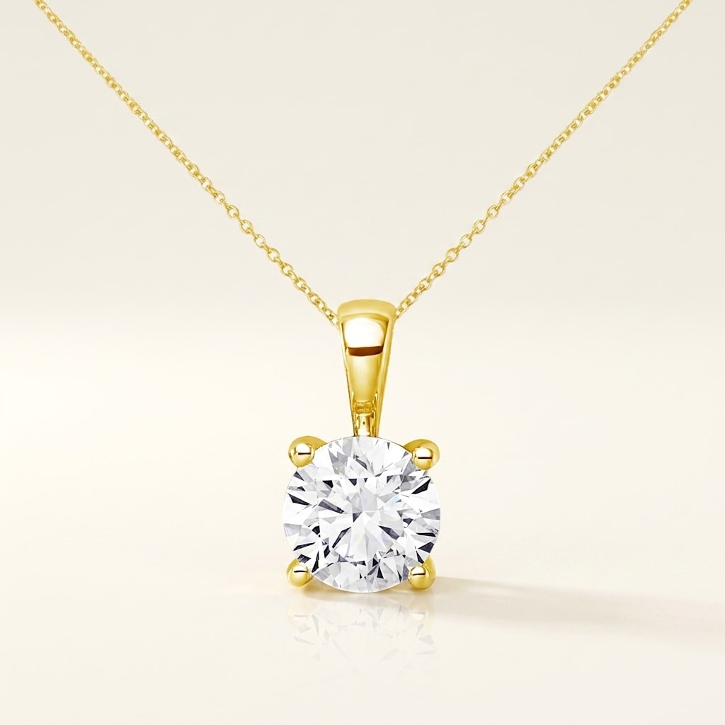ESSENTIEL Halskette und 0.5 Karat in Gelbgold 585