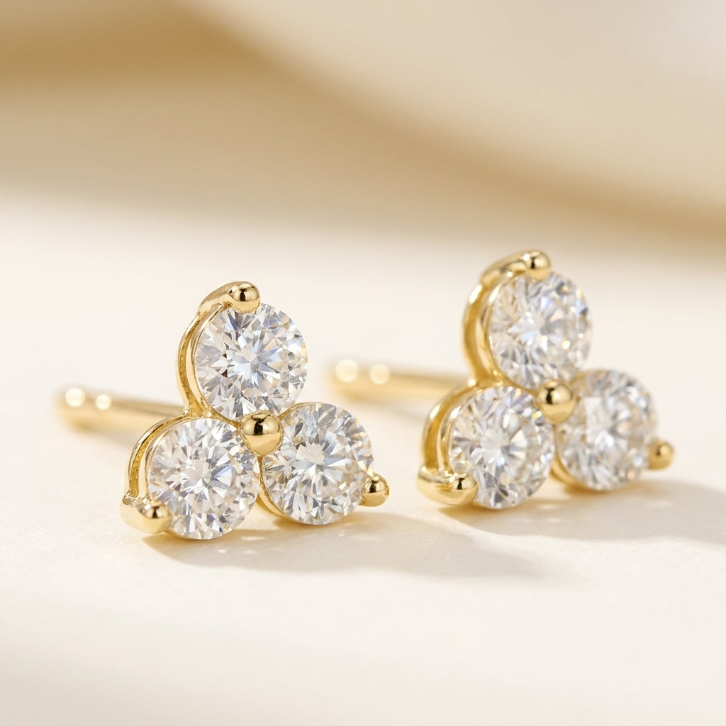 TROIS Ohrring und 0.6 Karat in Gelbgold 585